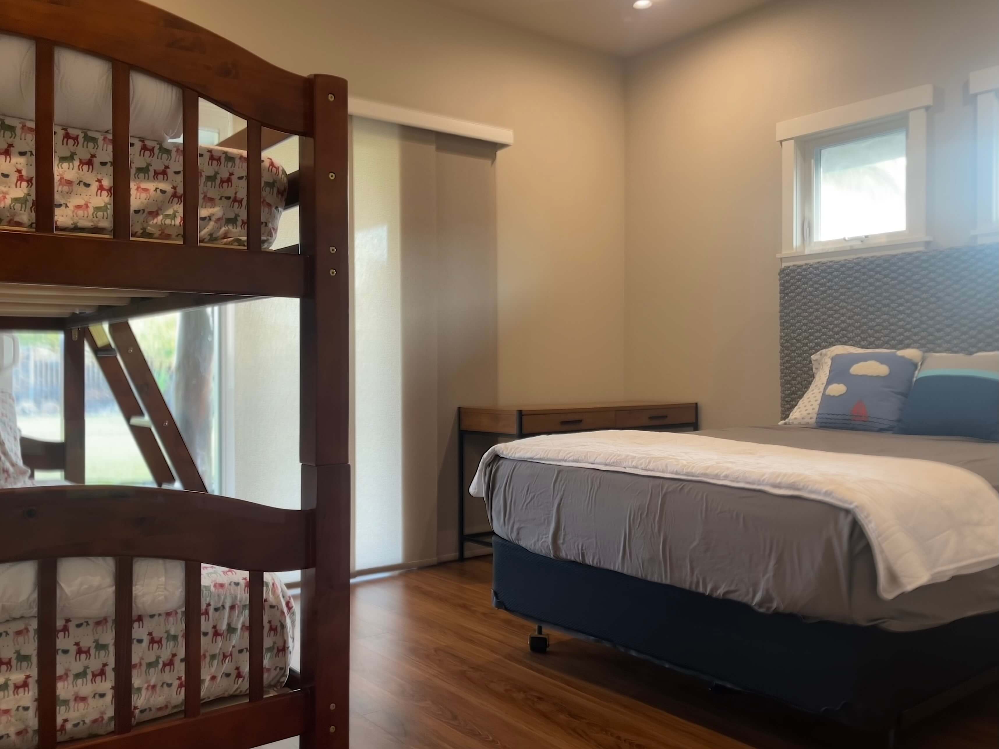 Bedroom with full size bed and a bunk bed